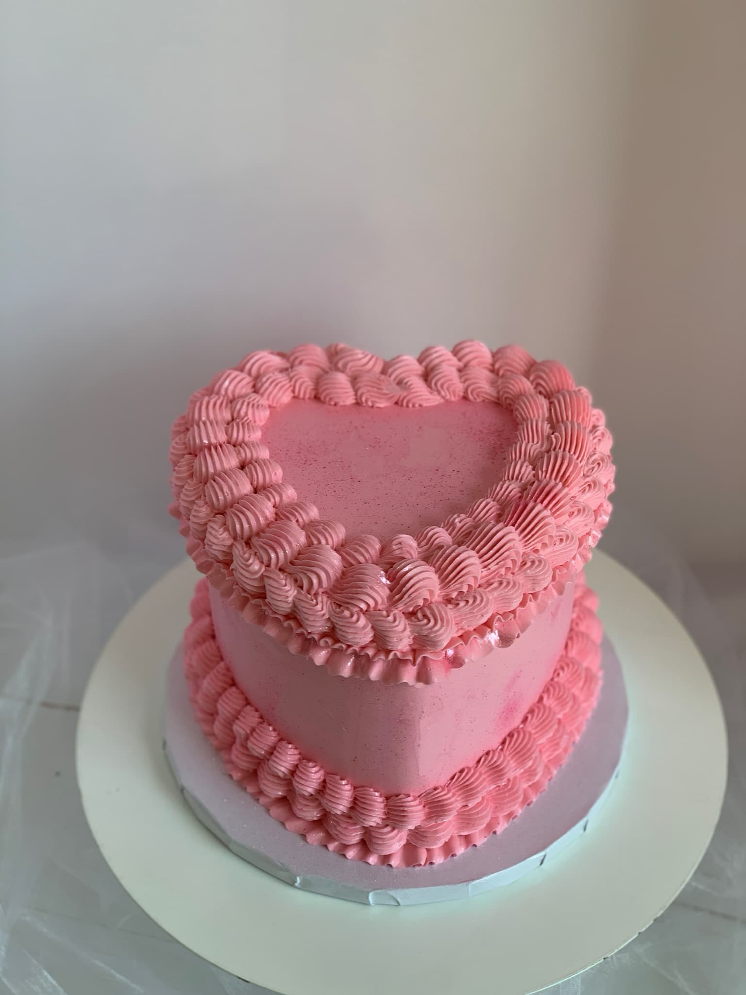 Pink heart shaped birthday cake