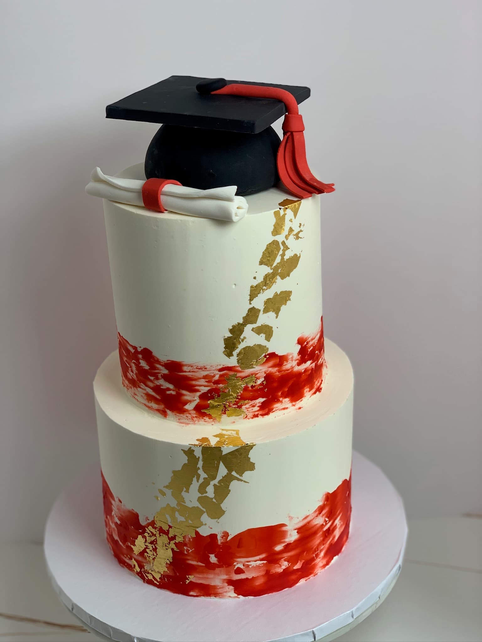Red brushstroke graduation two-tier cake