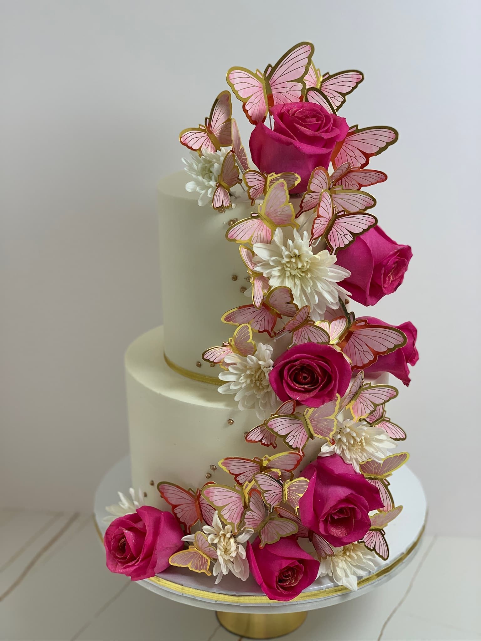 Butterfly and rose two-tier cake