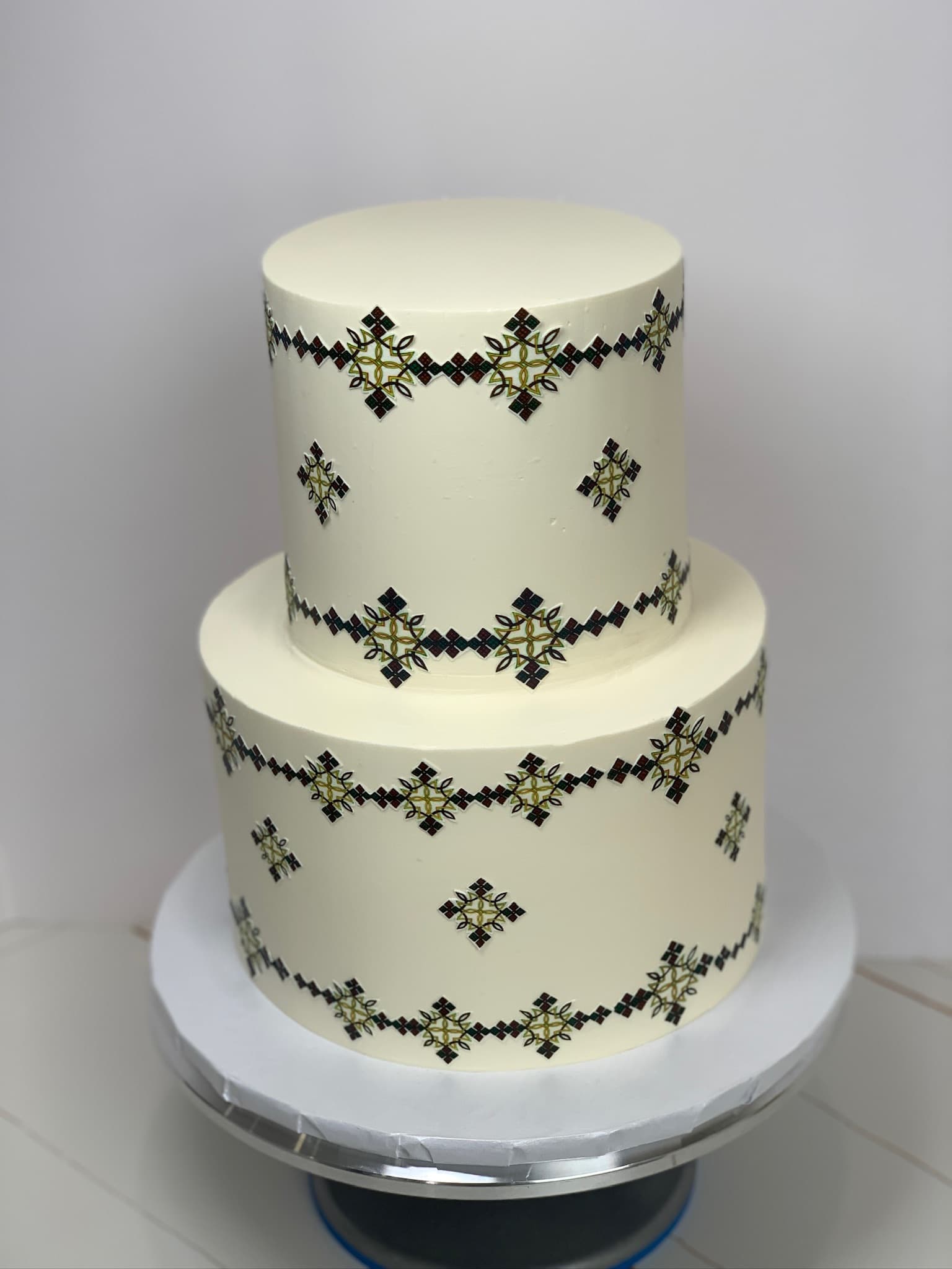 Cross-stitch two-tier cake — alternate angle