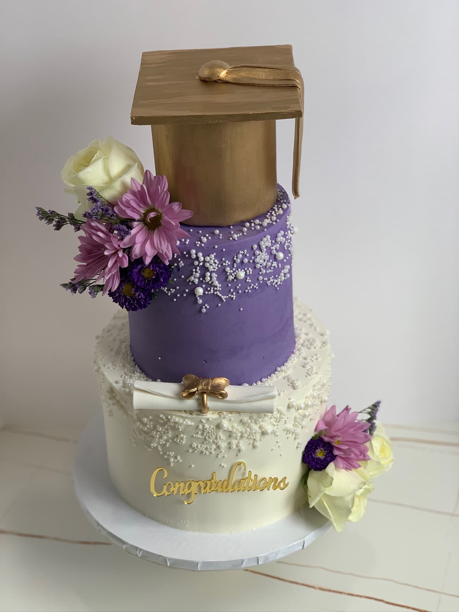 Purple congratulations graduation cake — side view